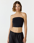 Elevate your warm-weather wardrobe with the Edie Bandeau Top from AOCO. This chic strapless design offers a flattering fit and endless style possibilities.