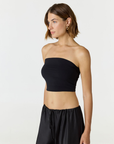 Elevate your warm-weather wardrobe with the Edie Bandeau Top from AOCO. This chic strapless design offers a flattering fit and endless style possibilities.