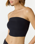 Elevate your warm-weather wardrobe with the Edie Bandeau Top from AOCO. This chic strapless design offers a flattering fit and endless style possibilities.