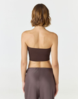 Elevate your warm-weather wardrobe with the Edie Bandeau Top from AOCO. This chic strapless design offers a flattering fit and endless style possibilities.