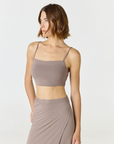 Elevate your everyday style with the Isla Cropped Tank by AOCO. Featuring a flattering fit and breathable fabric, it's the perfect warm weather staple.