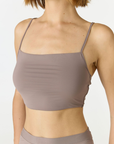 Elevate your everyday style with the Isla Cropped Tank by AOCO. Featuring a flattering fit and breathable fabric, it's the perfect warm weather staple.