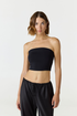 Elevate your warm-weather wardrobe with the Edie Bandeau Top from AOCO. This chic strapless design offers a flattering fit and endless style possibilities.