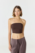 Elevate your warm-weather wardrobe with the Edie Bandeau Top from AOCO. This chic strapless design offers a flattering fit and endless style possibilities.