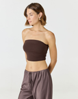 Elevate your warm-weather wardrobe with the Edie Bandeau Top from AOCO. This chic strapless design offers a flattering fit and endless style possibilities.