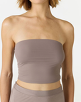 Elevate your warm-weather wardrobe with the Edie Bandeau Top from AOCO. This chic strapless design offers a flattering fit and endless style possibilities.