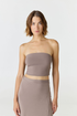 Elevate your warm-weather wardrobe with the Edie Bandeau Top from AOCO. This chic strapless design offers a flattering fit and endless style possibilities.