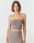 Elevate your warm-weather wardrobe with the Edie Bandeau Top from AOCO. This chic strapless design offers a flattering fit and endless style possibilities.