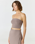 Elevate your warm-weather wardrobe with the Edie Bandeau Top from AOCO. This chic strapless design offers a flattering fit and endless style possibilities.