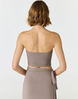 Elevate your warm-weather wardrobe with the Edie Bandeau Top from AOCO. This chic strapless design offers a flattering fit and endless style possibilities.