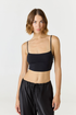 Elevate your everyday style with the Isla Cropped Tank by AOCO. Featuring a flattering fit and breathable fabric, it's the perfect warm weather staple.