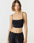 Elevate your everyday style with the Isla Cropped Tank by AOCO. Featuring a flattering fit and breathable fabric, it's the perfect warm weather staple.