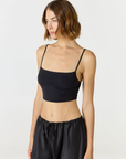 Elevate your everyday style with the Isla Cropped Tank by AOCO. Featuring a flattering fit and breathable fabric, it's the perfect warm weather staple.