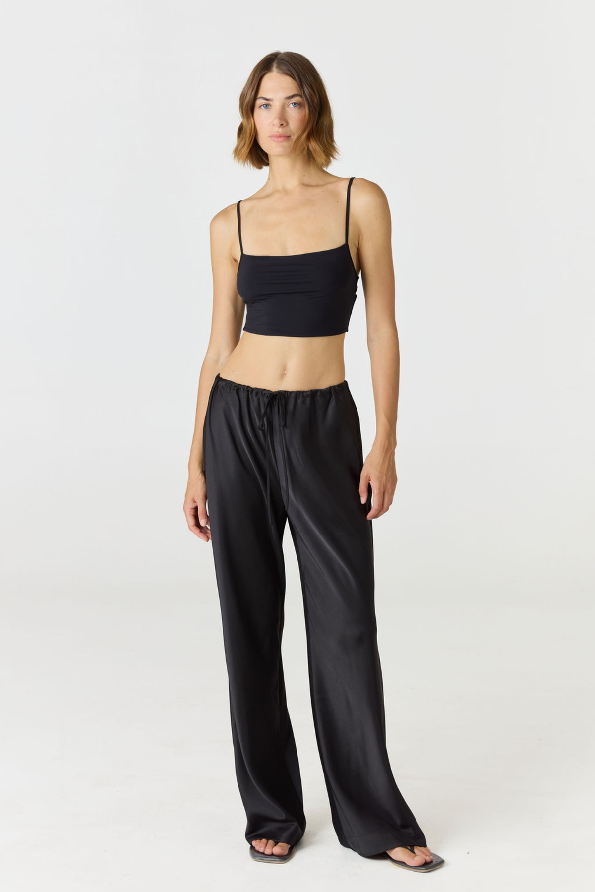 Elevate your everyday style with the Isla Cropped Tank by AOCO. Featuring a flattering fit and breathable fabric, it's the perfect warm weather staple.