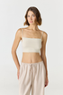 Elevate your everyday style with the Isla Cropped Tank by AOCO. Featuring a flattering fit and breathable fabric, it's the perfect warm weather staple.
