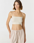 Elevate your everyday style with the Isla Cropped Tank by AOCO. Featuring a flattering fit and breathable fabric, it's the perfect warm weather staple.