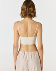 Elevate your everyday style with the Isla Cropped Tank by AOCO. Featuring a flattering fit and breathable fabric, it's the perfect warm weather staple.