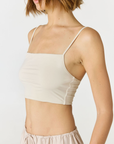 Elevate your everyday style with the Isla Cropped Tank by AOCO. Featuring a flattering fit and breathable fabric, it's the perfect warm weather staple.