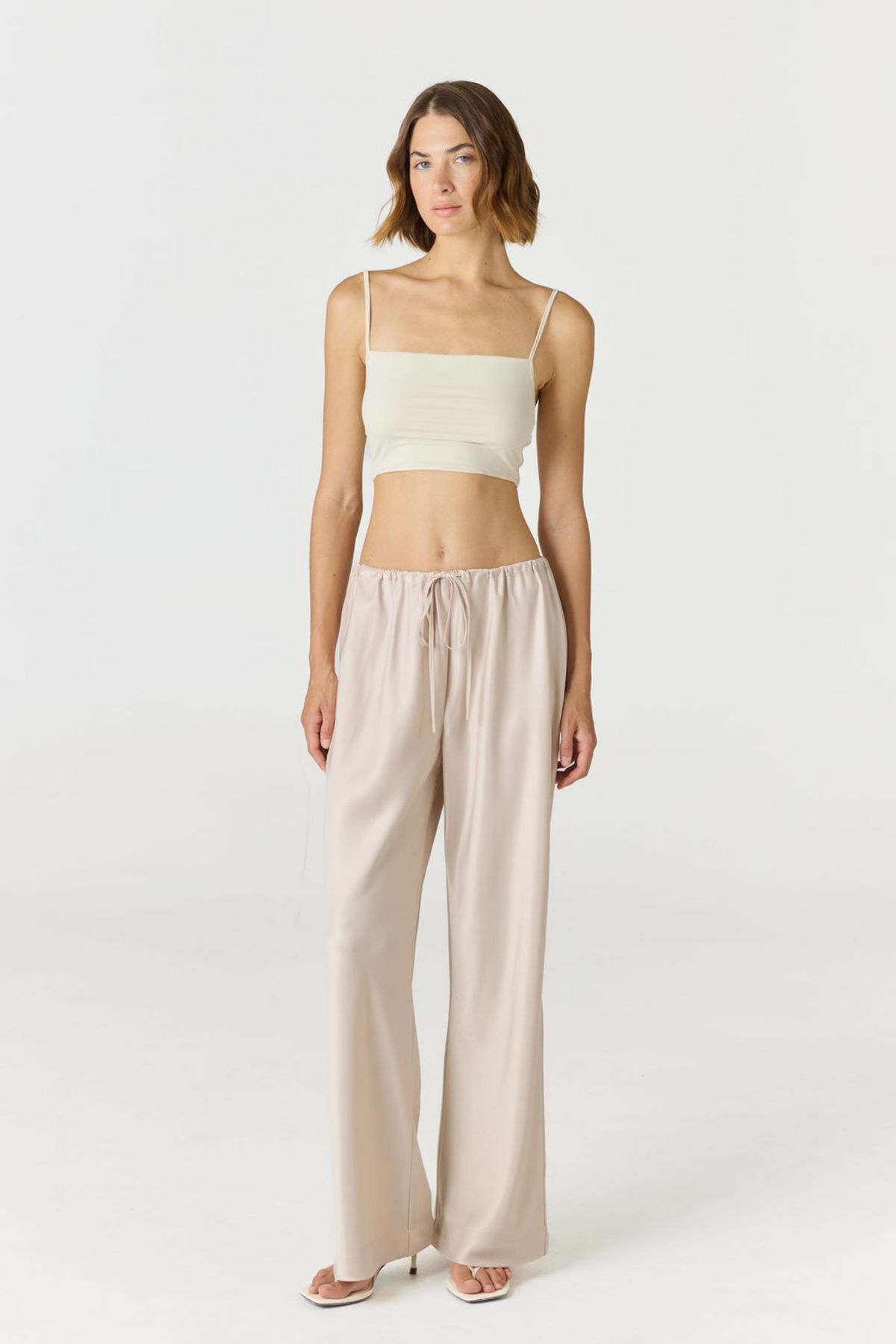 Elevate your everyday style with the Isla Cropped Tank by AOCO. Featuring a flattering fit and breathable fabric, it's the perfect warm weather staple.