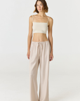 Elevate your everyday style with the Isla Cropped Tank by AOCO. Featuring a flattering fit and breathable fabric, it's the perfect warm weather staple.
