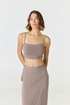 Elevate your everyday style with the Isla Cropped Tank by AOCO. Featuring a flattering fit and breathable fabric, it's the perfect warm weather staple.