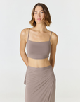Elevate your everyday style with the Isla Cropped Tank by AOCO. Featuring a flattering fit and breathable fabric, it's the perfect warm weather staple.