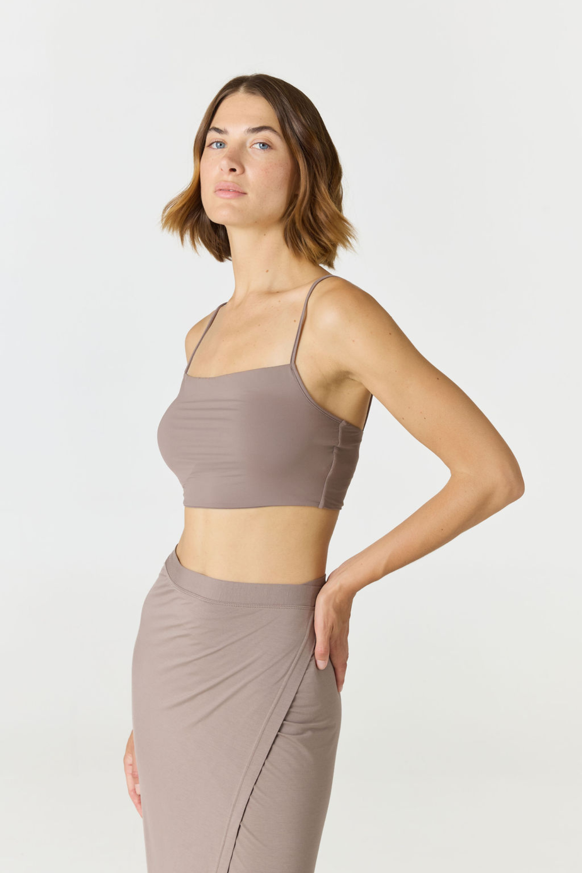 Elevate your everyday style with the Isla Cropped Tank by AOCO. Featuring a flattering fit and breathable fabric, it's the perfect warm weather staple.