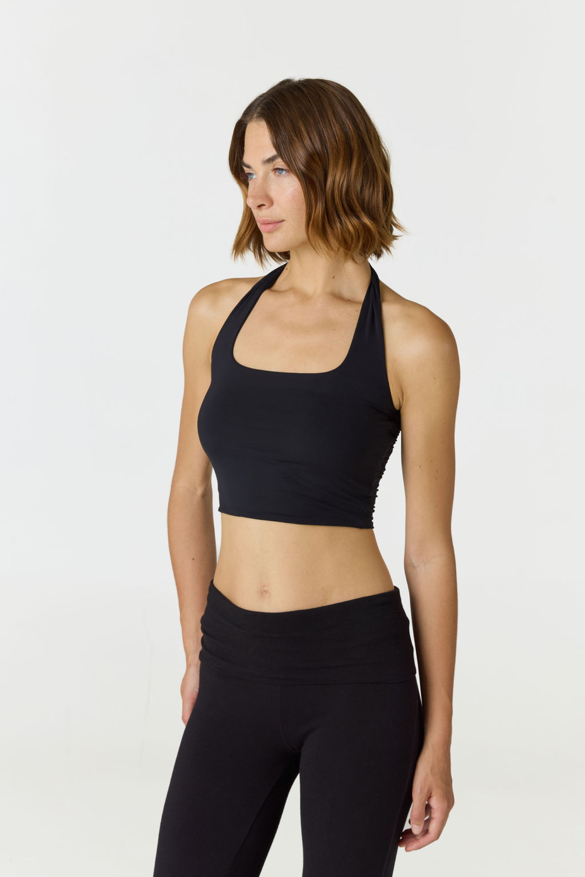 Refresh your summer wardrobe with the Mia Cropped Halter from AOCO. Featuring a chic halter neckline and a flattering cropped fit, it's a warm weather must.